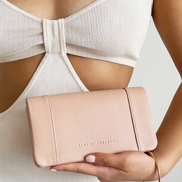 woman holding the Some Type of Love Dusty Pink Wallet