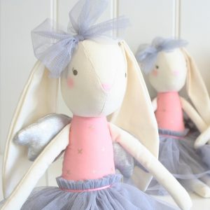 two Alimrose Silver Angel Bunny dolls sitting on a shelf