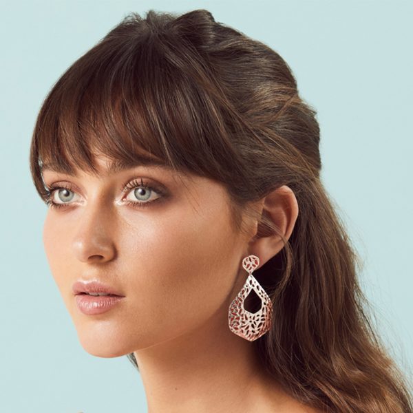 model wearing the Nicole Fendel Rose Gold Ava Statement Earrings