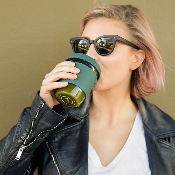 woman drinking from her Deep Sea Green SoL Cup