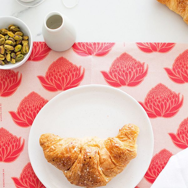 croissant on red flower food wrap
