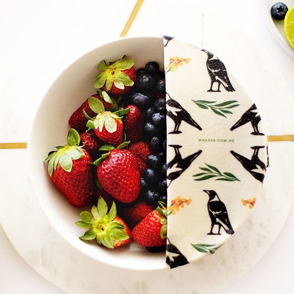 bowl full of berries and food wrap cover