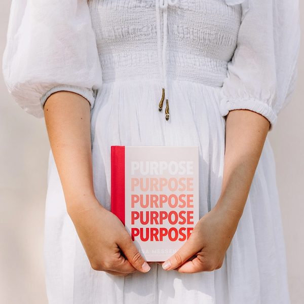 lady holding PURPOSE Mini Journal