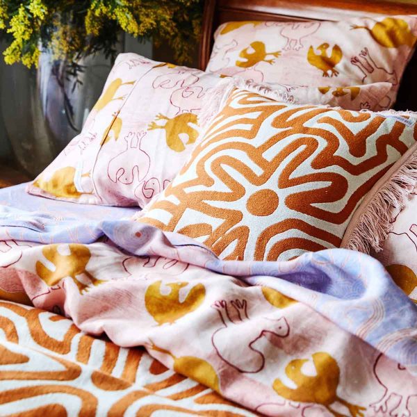 kipandco-Kalaya-Tjukurpa-Rust-Woven-Cushion-and-bedspread-styled